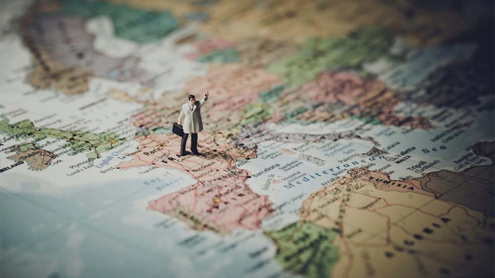 A photo of a figurine on a map to illustrate journey mapping